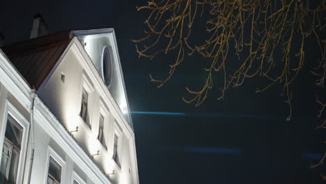 illuminated european building at night with christmas decorations