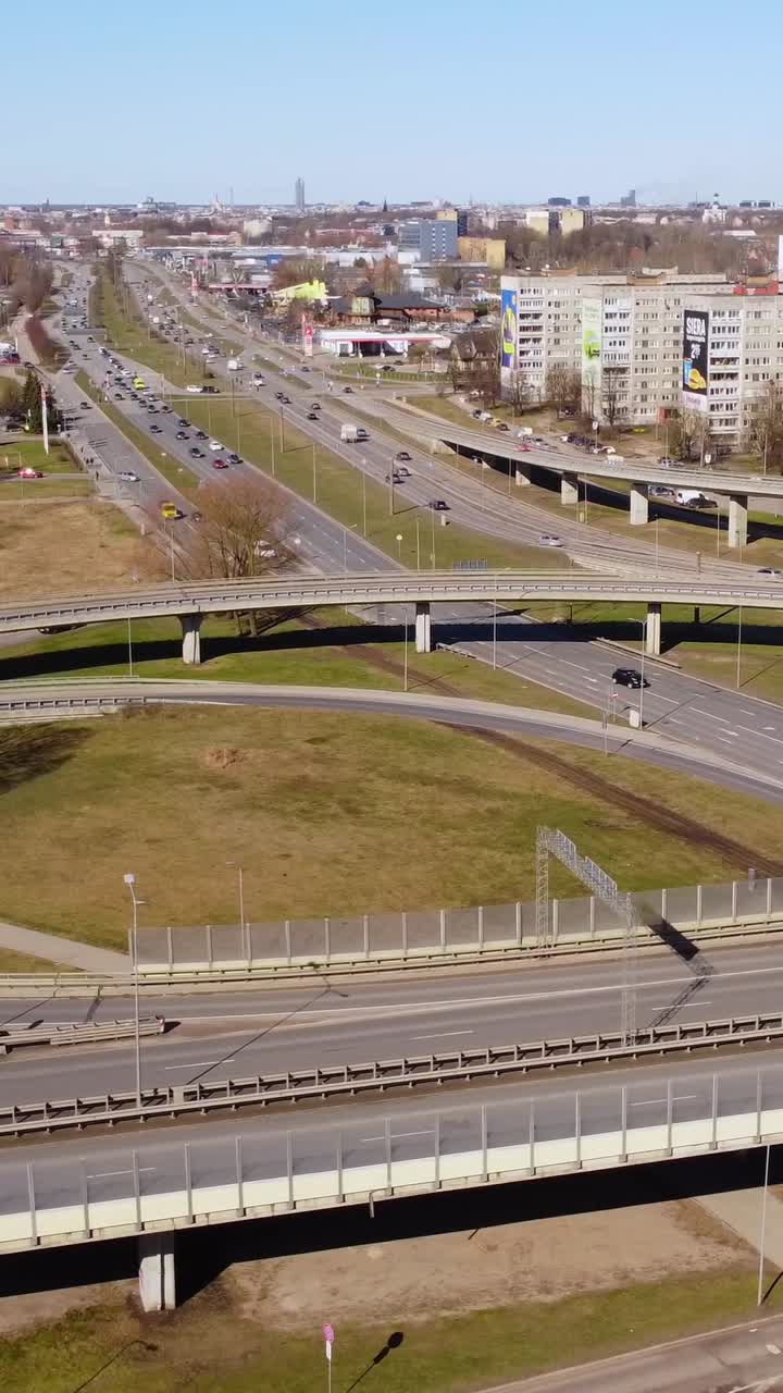 Vertical aerial drone shot of busy intersection and traffic in Riga, Latvia