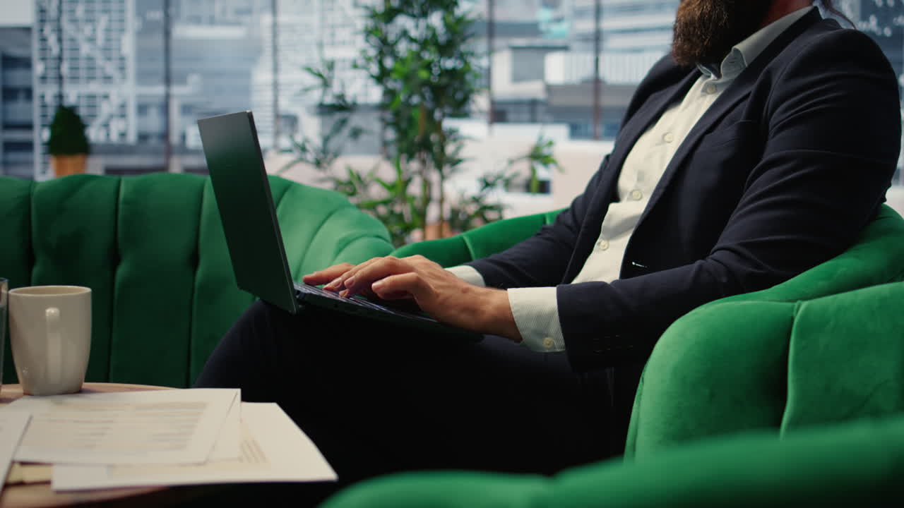 Vertical Video Close up of businessman typing information for daily tasks on laptop