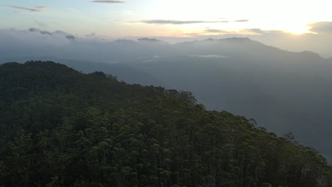 Aerial-drone-forward-moving-shot-over-Ella-Rock-with-famous-viewpoint-visa-in-Sri-Lanka-while-hiking-at-sunrise