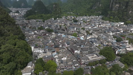 aerial view of a chinese town nestled among karst mountains