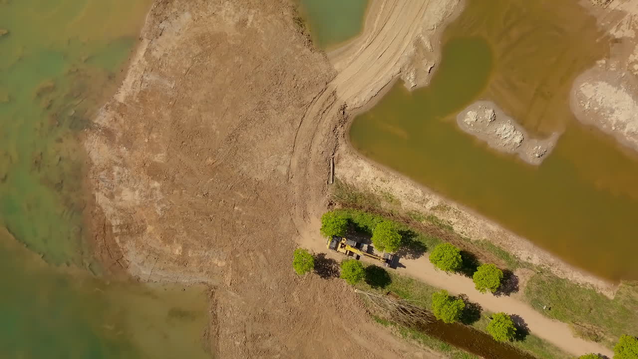 Aerial drone shot of the bird-eye view at the sand mining site in the Netherlands, Europe.