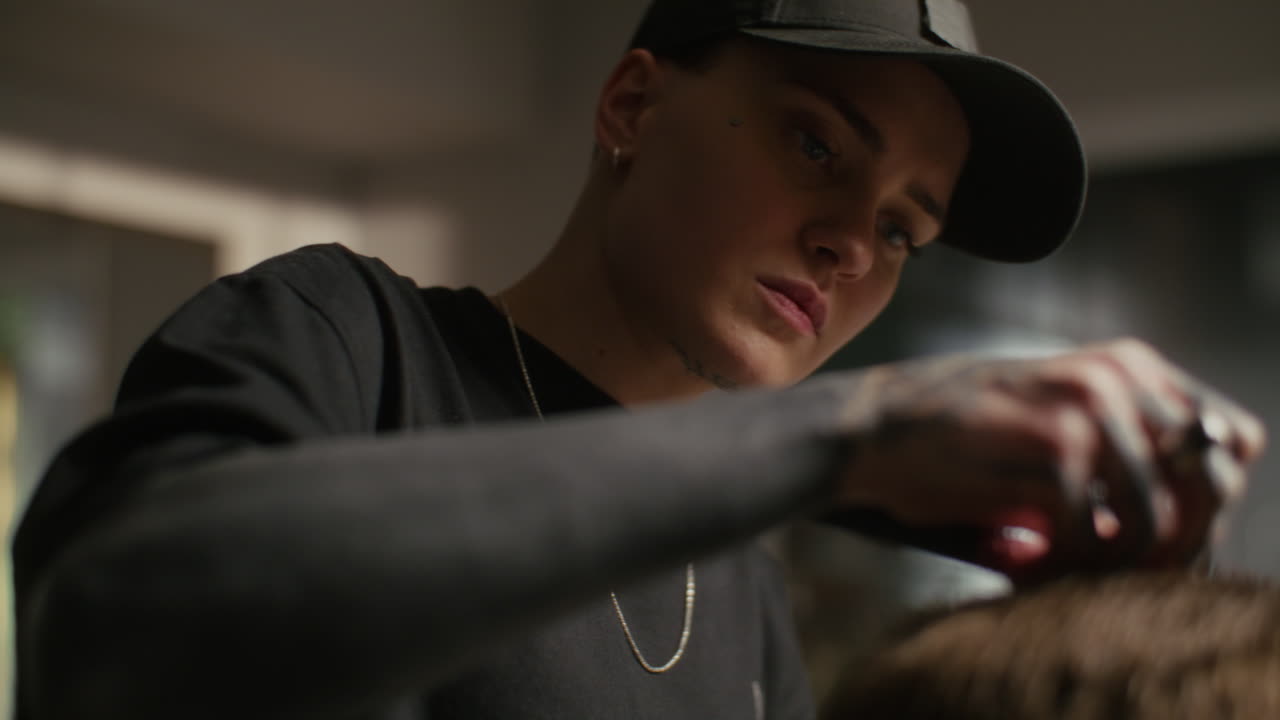 Hairdresser giving a haircut