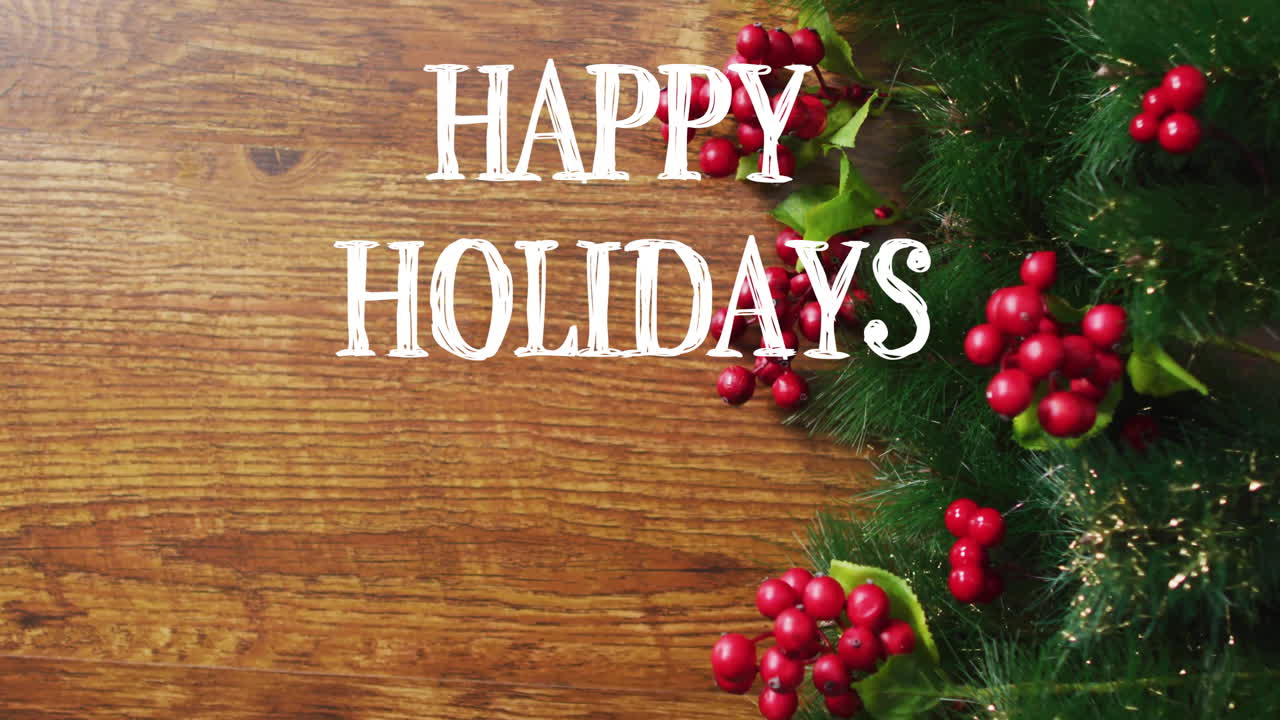 Happy Holidays text animation over wooden background with festive decorations