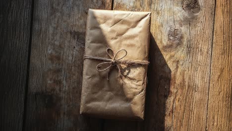 a gift wrapped in brown paper and tied with string