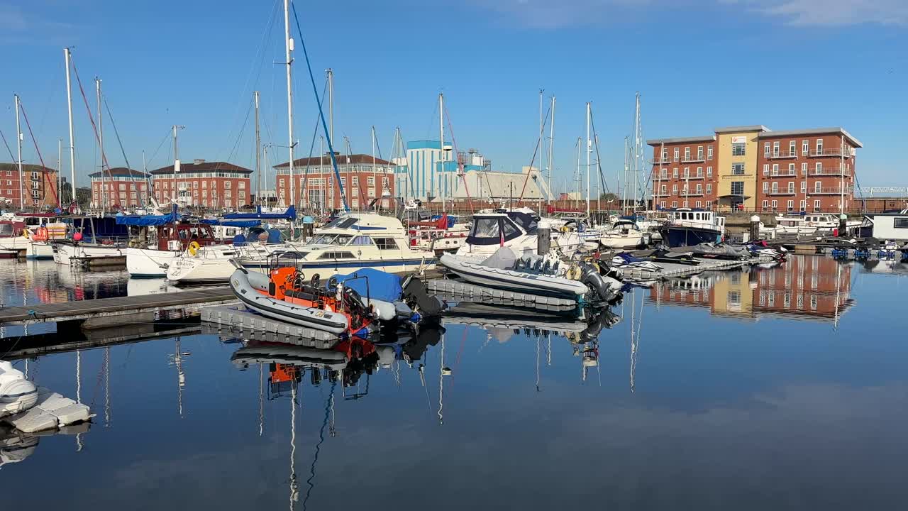 Aerial drone video of Hartlepool North East England UK coastal town with marina, harbour, and seaside urban landscape
