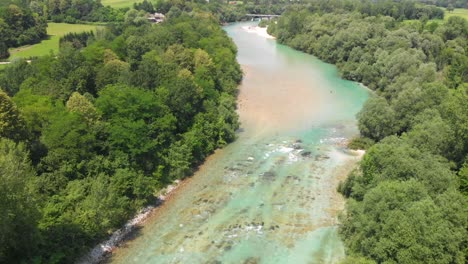 fly fishing in a beautiful soca river, slovenia, drone tilt down shot, summer