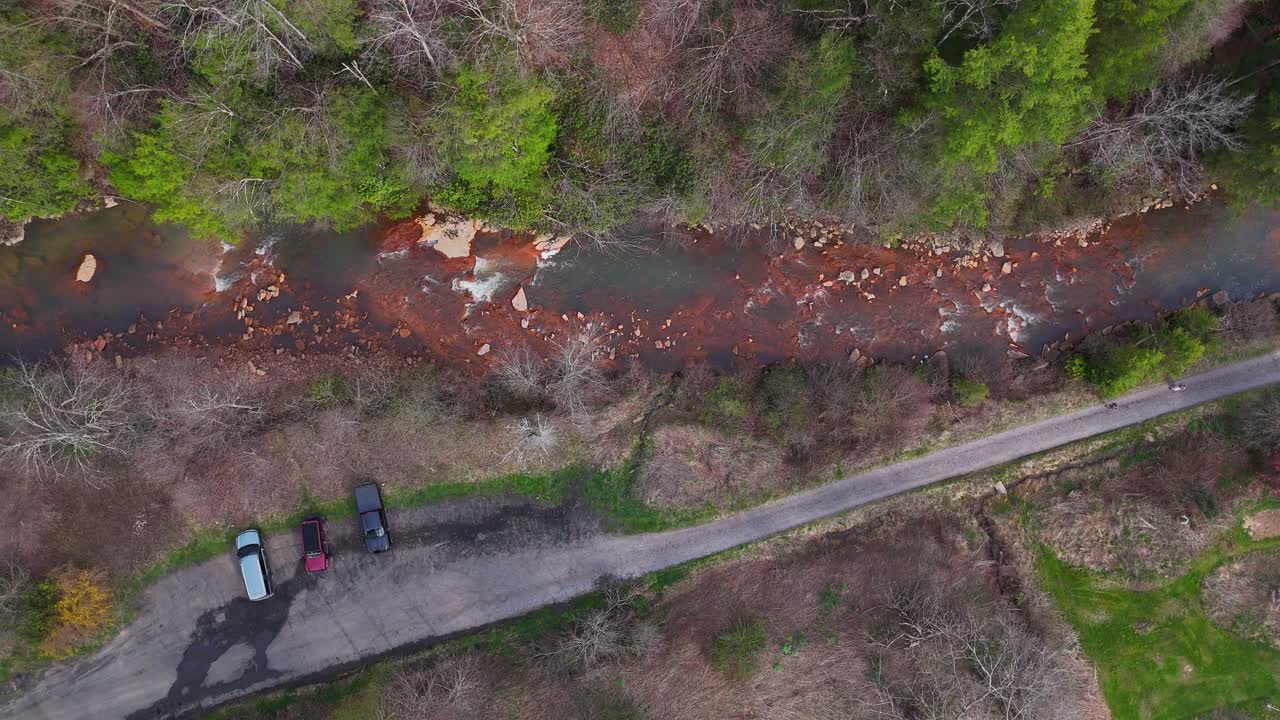 Aerial of North Fork Blackwater River winding through trees in fall, West Virginia, USA
