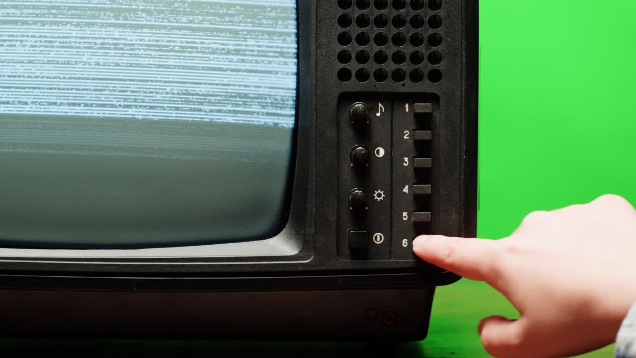 Retro Style TV Set with Green Screen chroma key background, vintage 60s analog television with grain and noise.