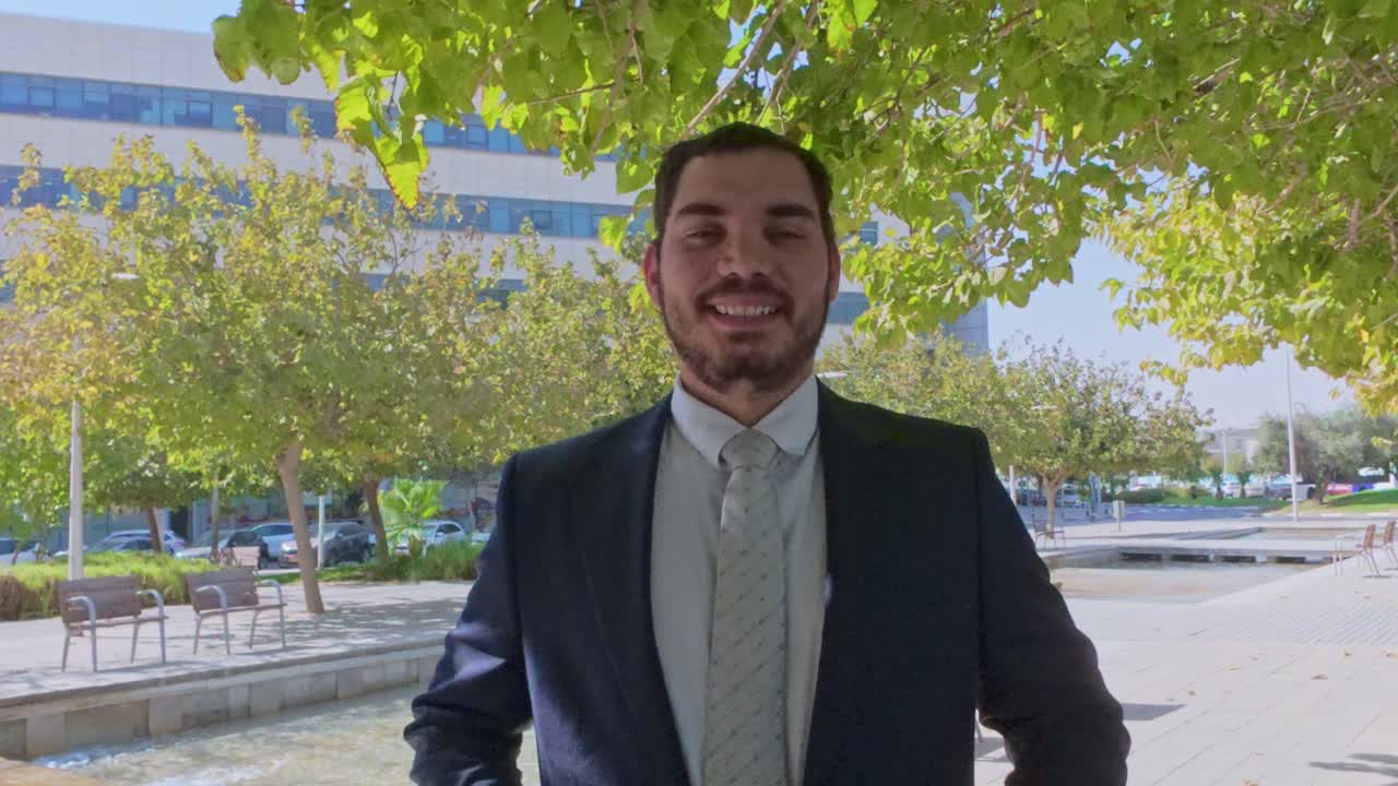 Confident Middle Eastern Businessman with Arms Crossed Outdoors