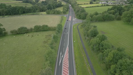 busy rural road a66 with reveal of mountainous horizon on cloudy summer day