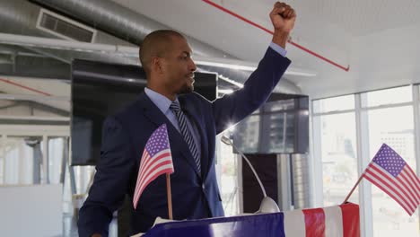 Victorious-male-speaker-at-political-convention