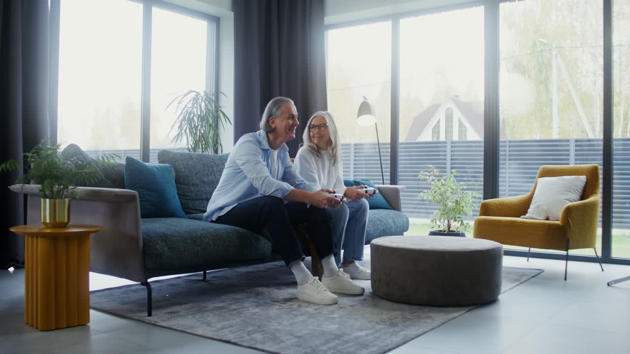 Senior Couple Enjoying Video Games at Home