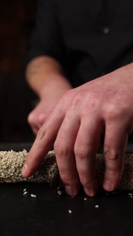 chef preparing sushi rolls