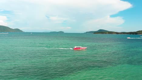 Speedboats-cruising-along-the-coasts-of-Rawai-beach-in-the-Andaman-Sea,-located-in-the-island-of-Phuket,-a-province-in-the-south-of-Thailand