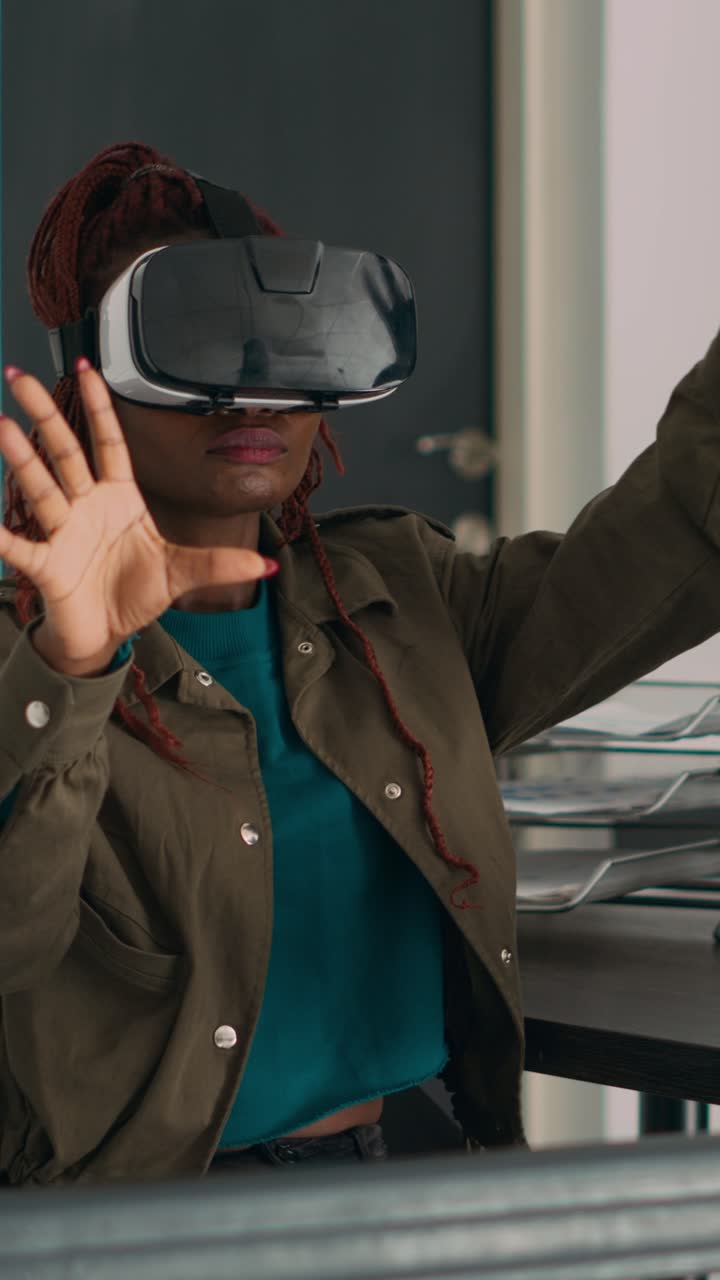 Vertical video: African american developer working with vr glasses