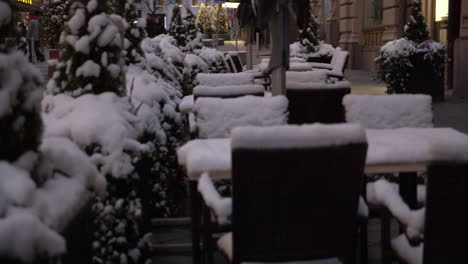 closed down snowy terrace patio in the city