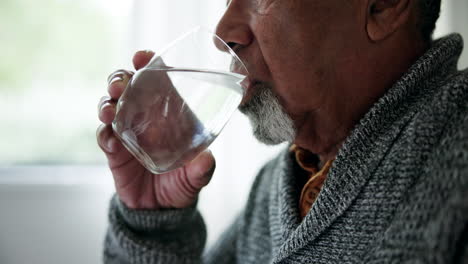 Home,-health-and-old-man-drinking-water