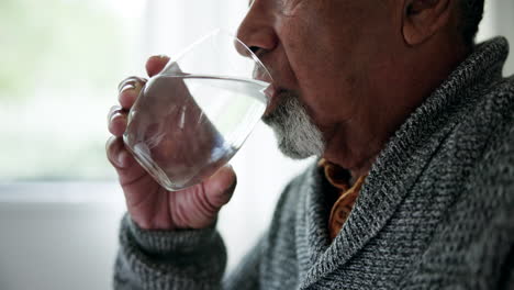 home, health and old man drinking water