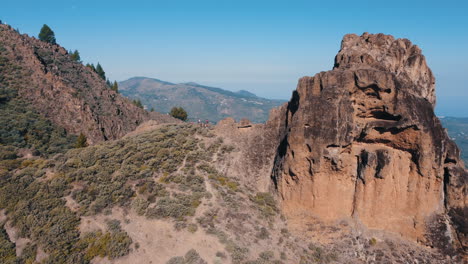 aerial shot in orbit a short distance from the famous roque saucillo and where a group of tourists is