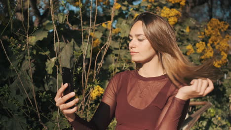 young woman using smartphone outdoors.