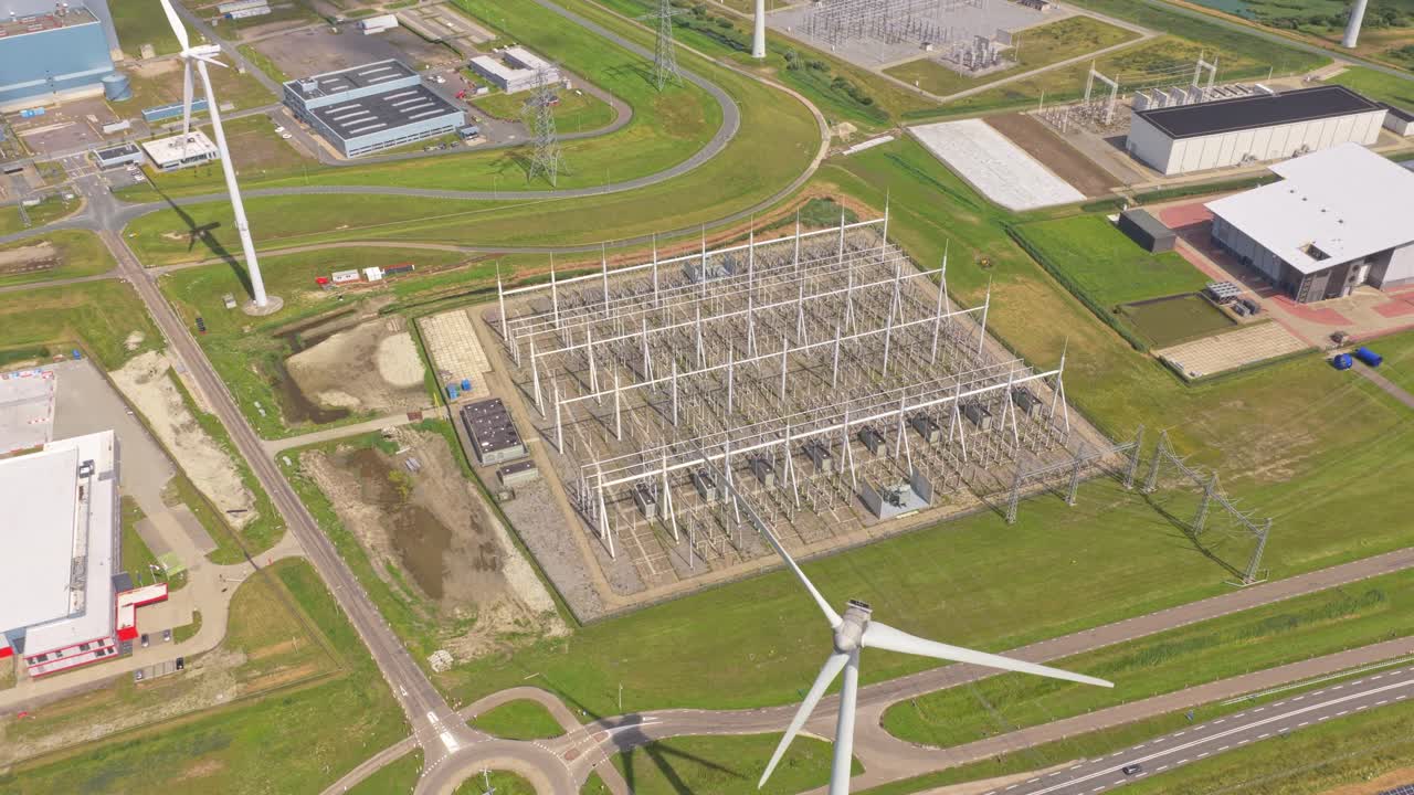 Wide aerial view of energy transmission network and high voltage pylons