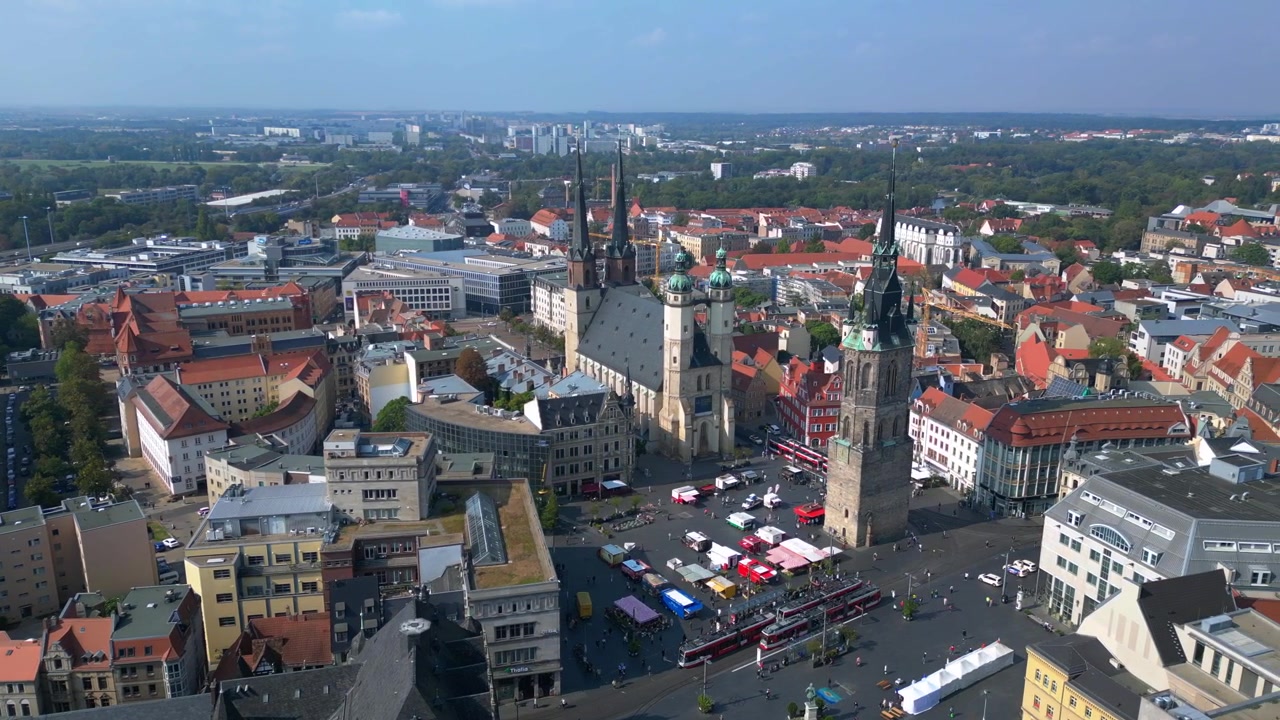 market square with the red tower and st. Mary's church in halle saale, germany. Best aerial view flight drone shot footage from above