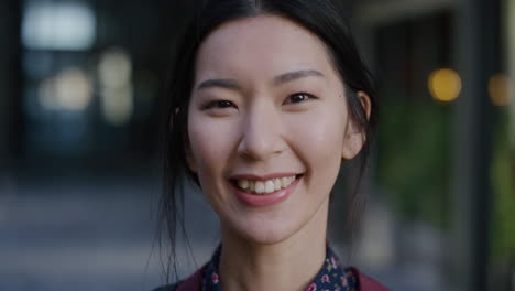 close-up-portrait-beautiful-young-asian-woman-student-smiling-enjoying-comfortable-urban-lifestyle-cute-happy-female-in-city-slow-motion-feminine-beauty