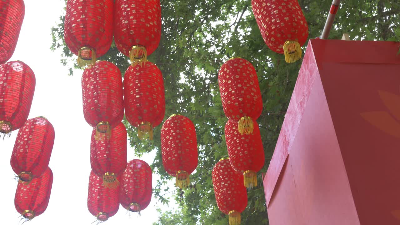 View below red hanging Chinese laterns