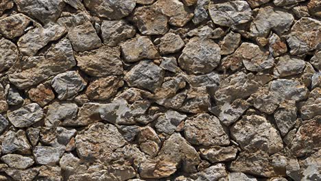 moving stone wall background. seamless loop.