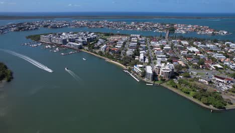 motorboats cruising in the blue sea with calm waters along the paradise point in queensland, australia