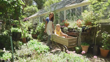 mother and daughter enjoying time in garden