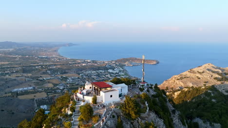 drone descending in front of the holy monastery of the virgin mary tsambika in rhodes