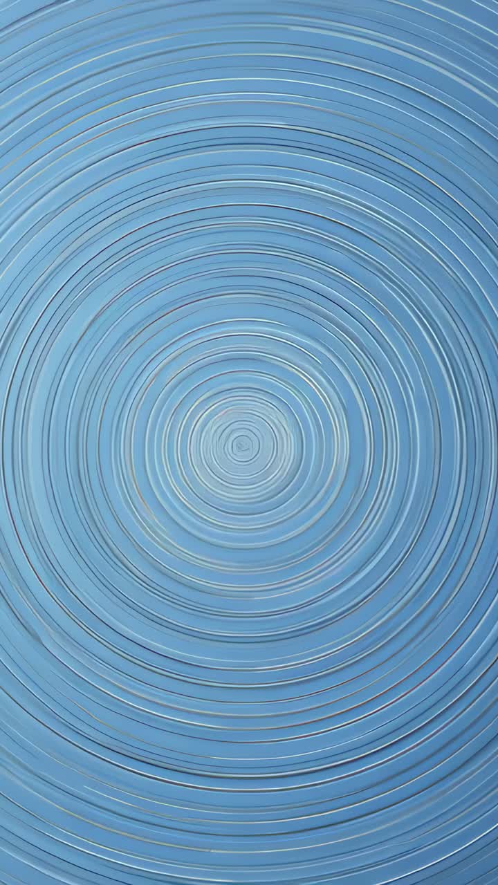 Vertical video: Playing concentric rings expanding on pale blue panel, showing core and ridge gleam