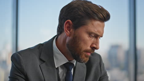 stressed executive looking problem solution at panoramic workplace portrait.