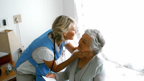 female doctor visiting her senior patient for routine checkup