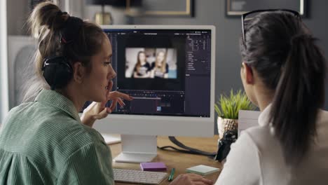 Rear-view-women-working-at-home-together-about-film-editing.