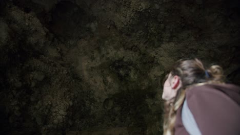 A-young-blond-girl-tourist-is-visiting-some-ancient-ruins-in-Capri,-in-Italy