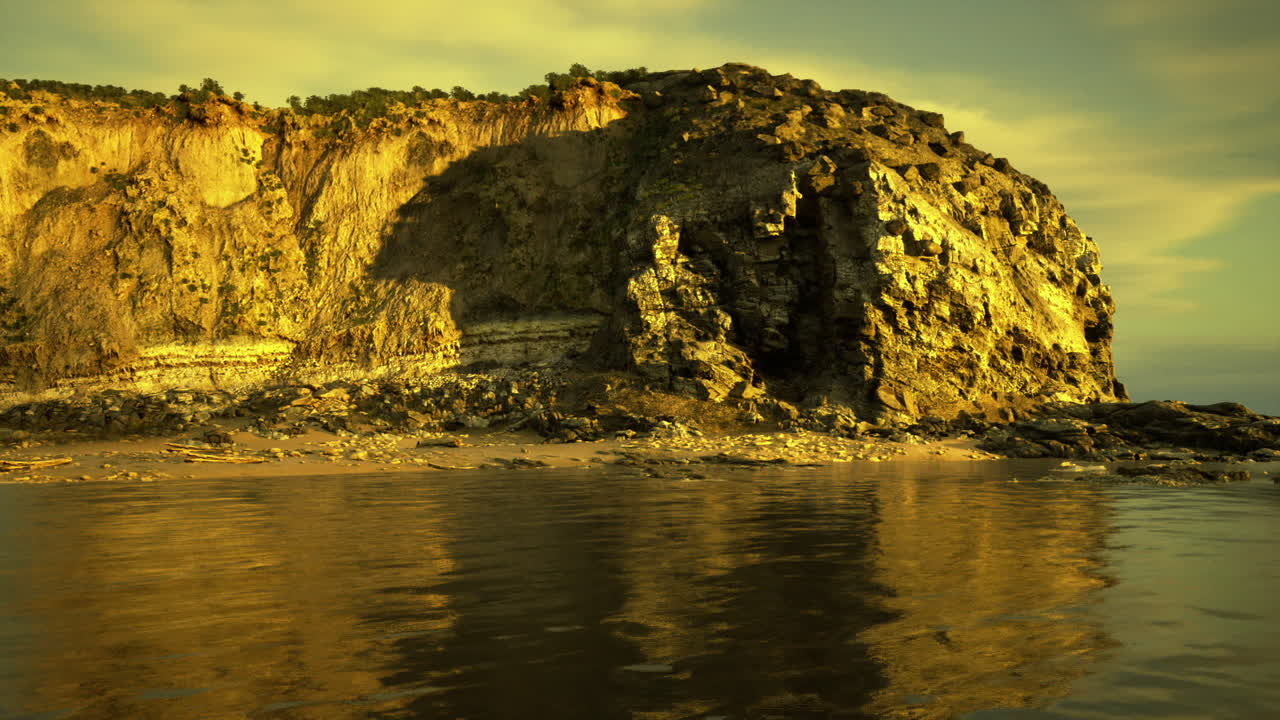 Stille aften ved klipperne med blid refleksion på roligt vand.