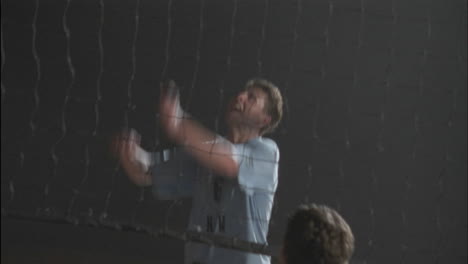 men's volleyball teams play a game