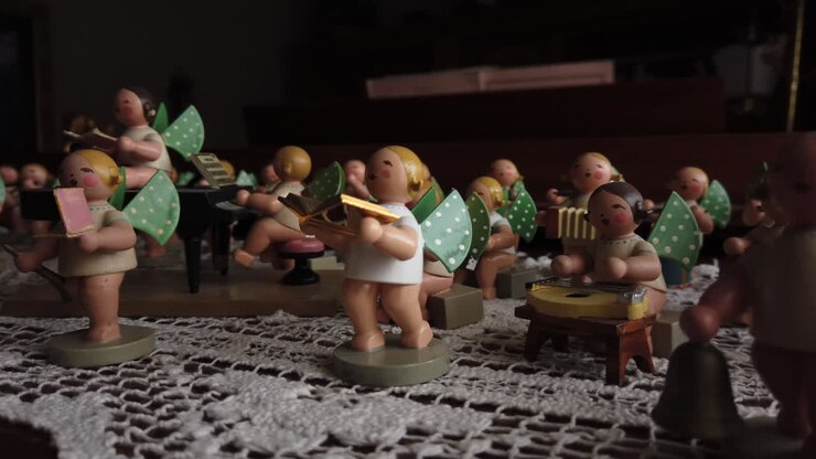 Medium close panning shot of a Hummel figurine orchestra