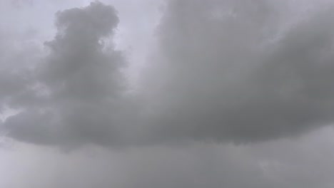timelapse real-time footage of thick, dark storm clouds forming in sky before heavy rain. ideal for weather updates, climate visuals or dramatic nature scenes