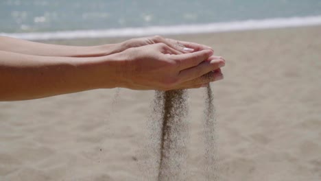 Stream-of-sand-pouring-from-hands