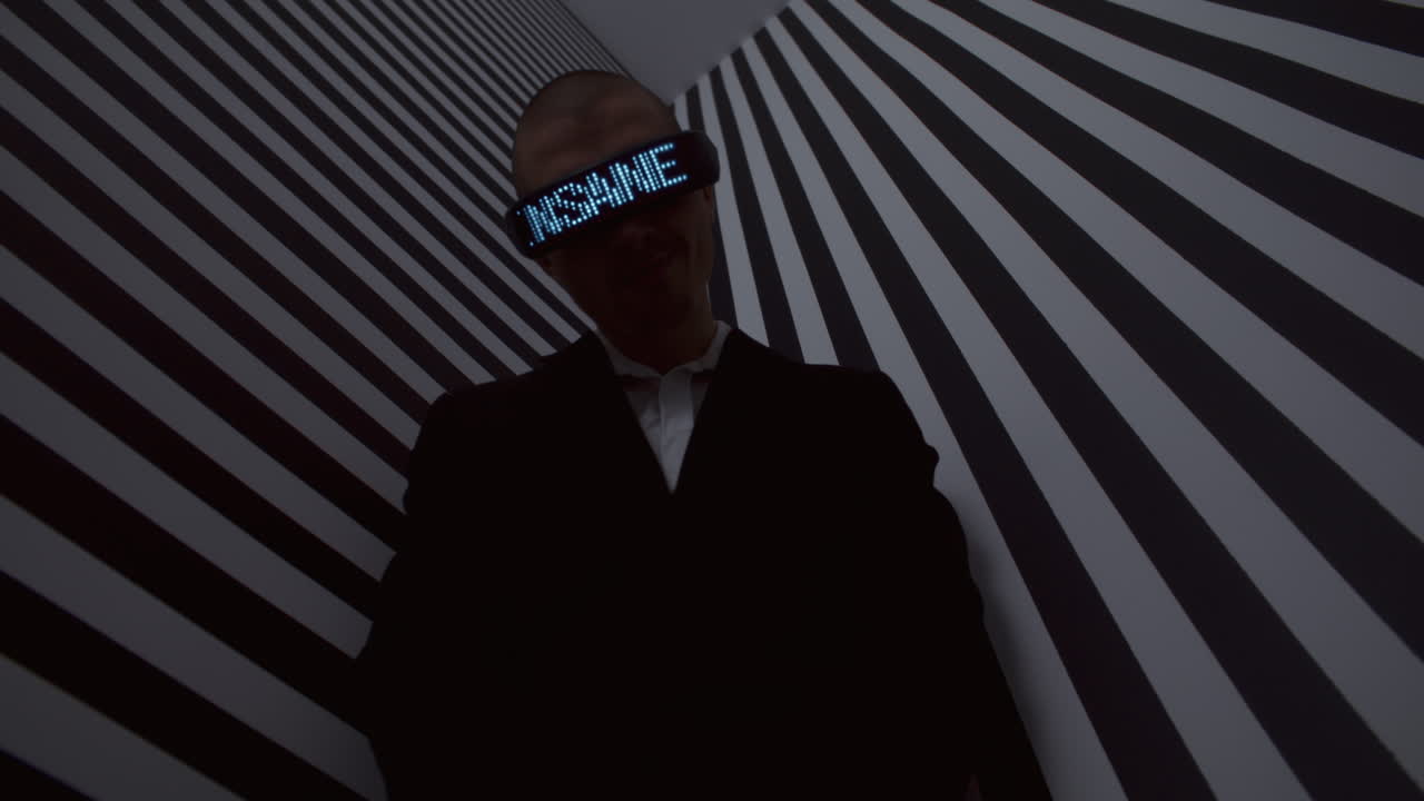 Man Wearing VR Headset Against Striped Wall