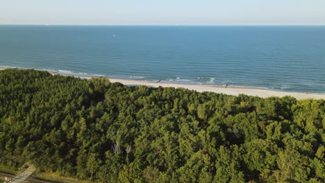 slow aerial right side movement over kuznica beach, a tourist spot in hel peninsula, poland, baltic sea