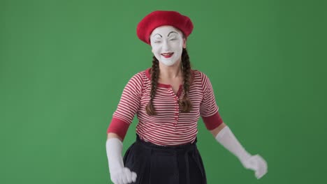 mime artist greeting and showing heartfelt gratitude towards her fans from the stage