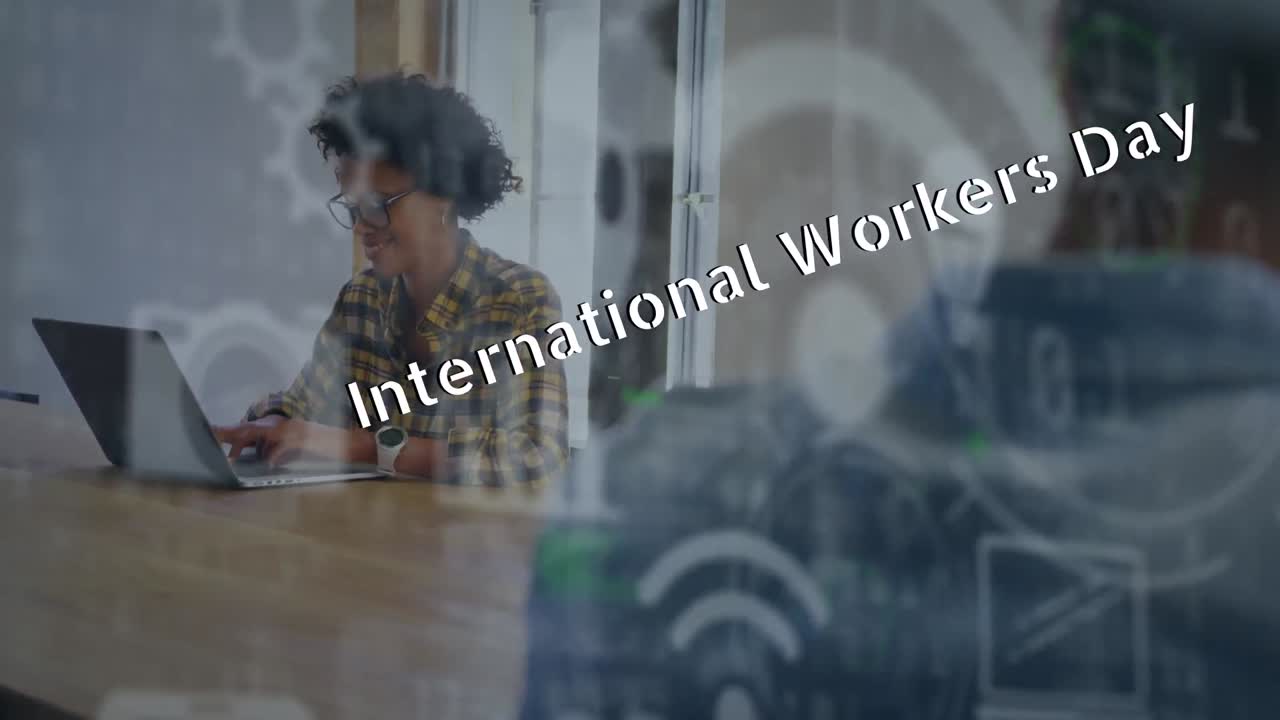 Animation of international workers day text over diverse business people in office