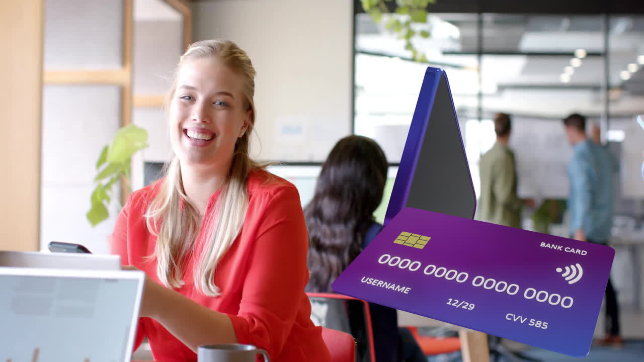 Animation of credit cards spinning over caucasian businesswoman using smartphone