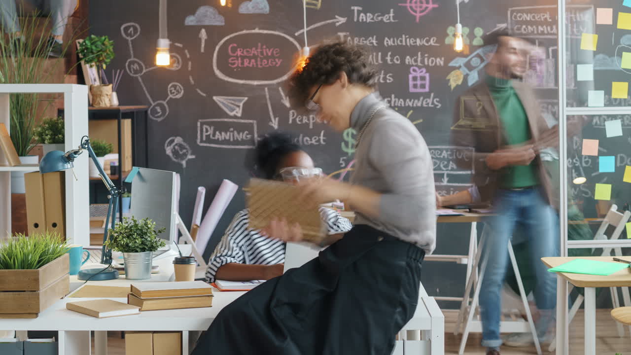 Busy creative office team working together