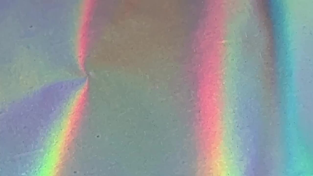 Abstract Holographic Surface Reflecting Vibrant Rainbow Light